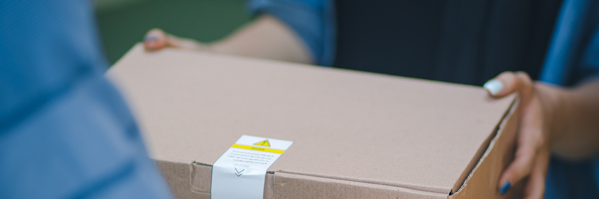 Header image showing a man handing a woman a box during homebound delivery exchange