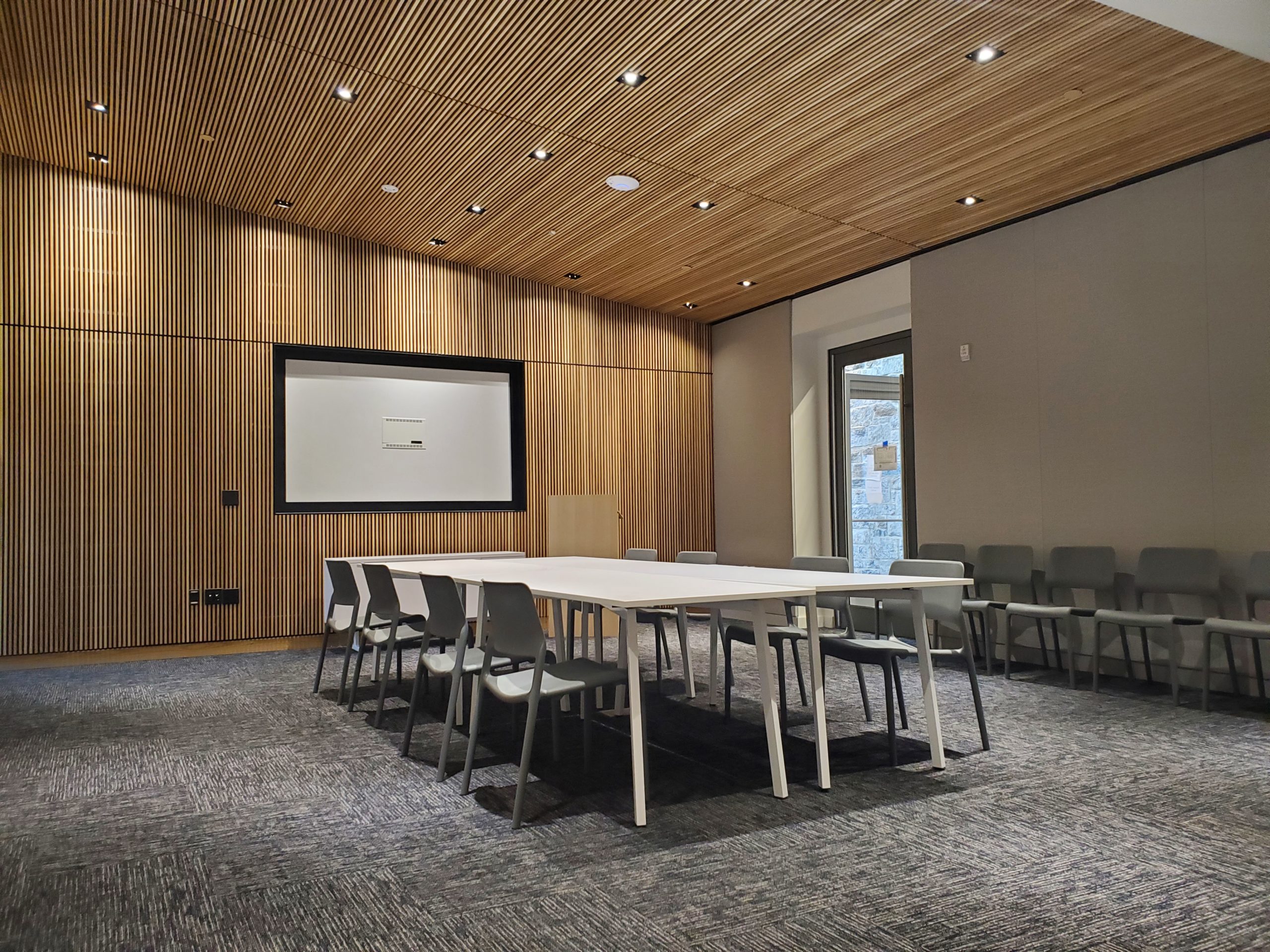 Interior photo showing a meeting room with tables and chairs