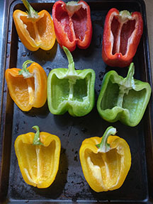 Bell pepper halves on sheet pan