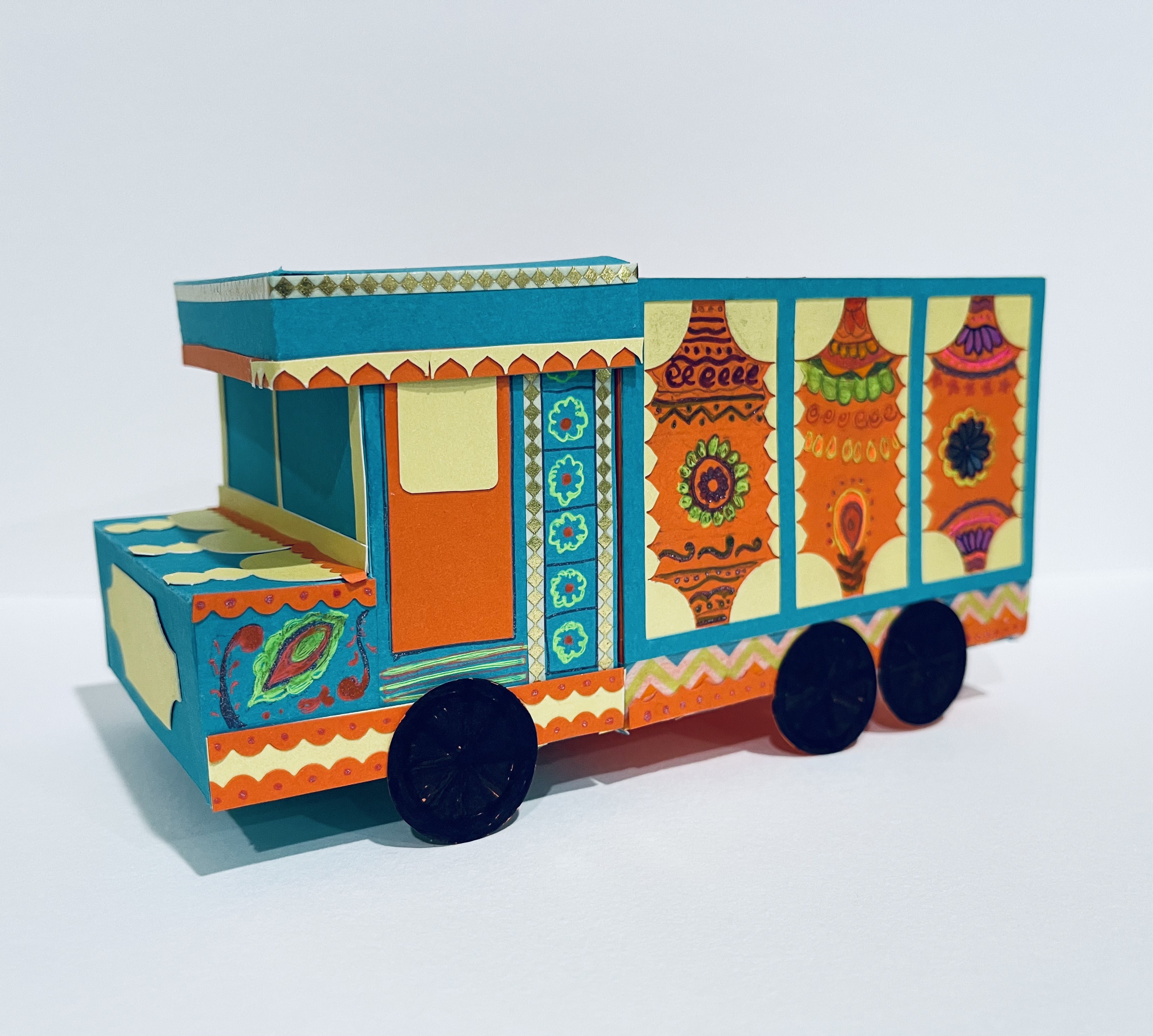 Sample of a truck painted artfully with teal and orange