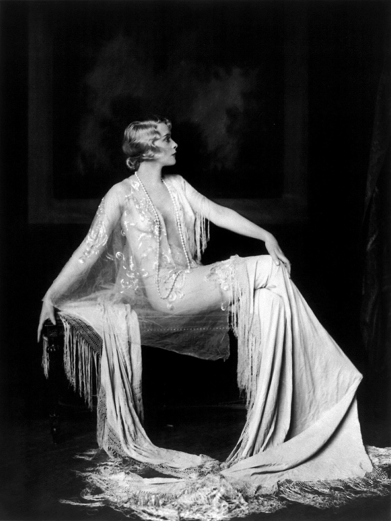 Muriel Finlay sitting in a glamourous gown