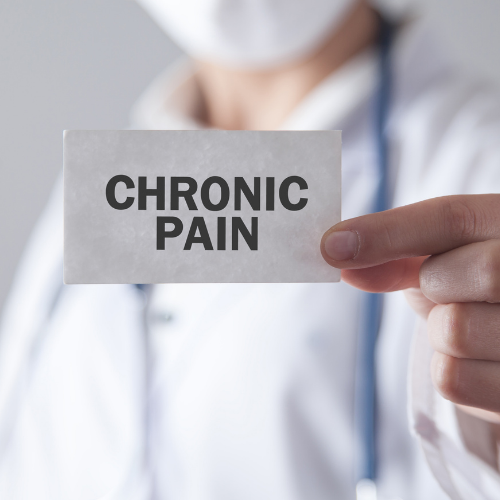 Holding a card labeled Chronic Pain