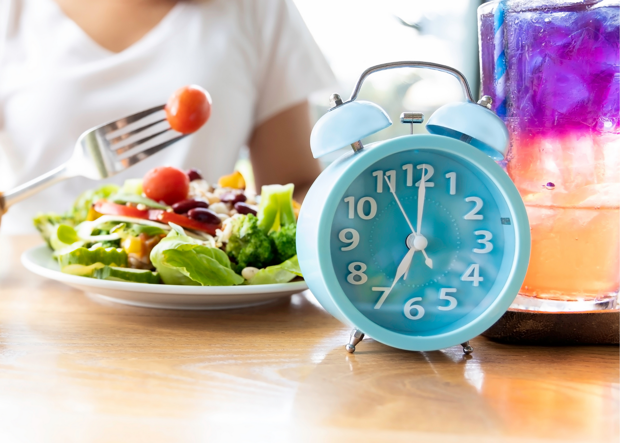 Plate of salad with an alarm clock