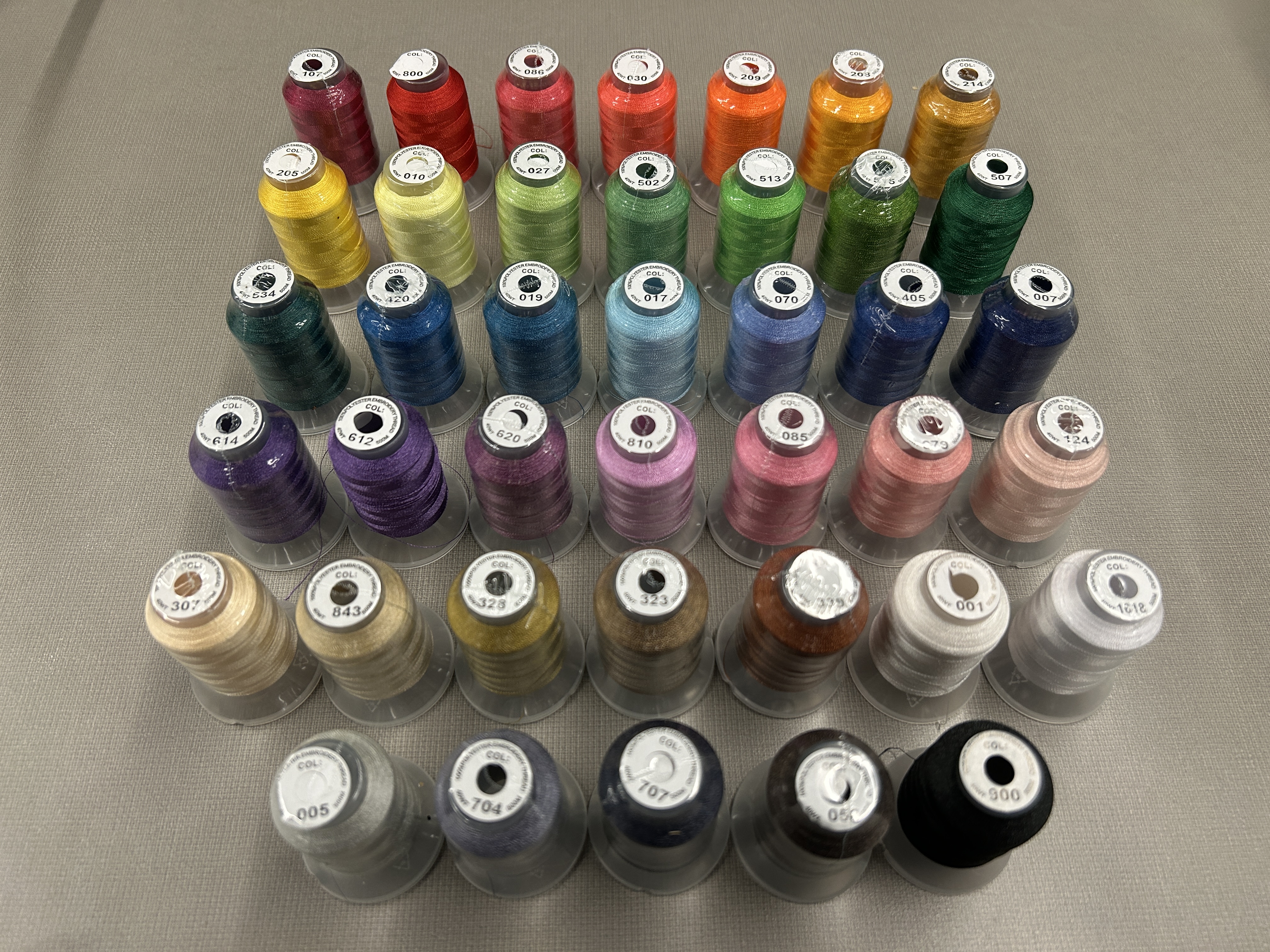 A photo of the embroidery thread SPL offers ordered by color