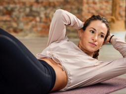 Exercise - Woman on the floor doing crunches