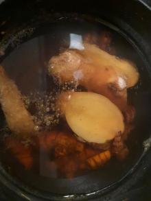 Boiling the turmeric and ginger