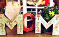"Mom" spelled out in wood block letters